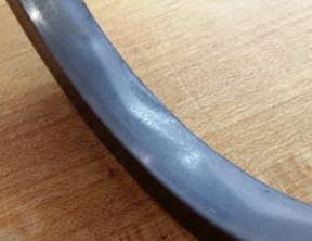This high pressure rotary shaft seal is still in excellent condition after 50 hours of 4,800 to 5,000 psi (33.09 to 34.47 MPa) operation at 80 sfpm (0.41 m/s) while bridging 0.020” (0.51mm) diametric clearance between the seal housing and the rotating mandrel. The test was directed at rotating cement heads used for oilfield well cementing operations.