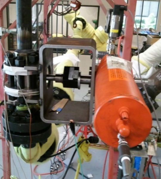 Figure 1: Test specimen instrumented with torque cell, position indicator, and pressure transducer. Instrumentation was used to measure the total required torque.