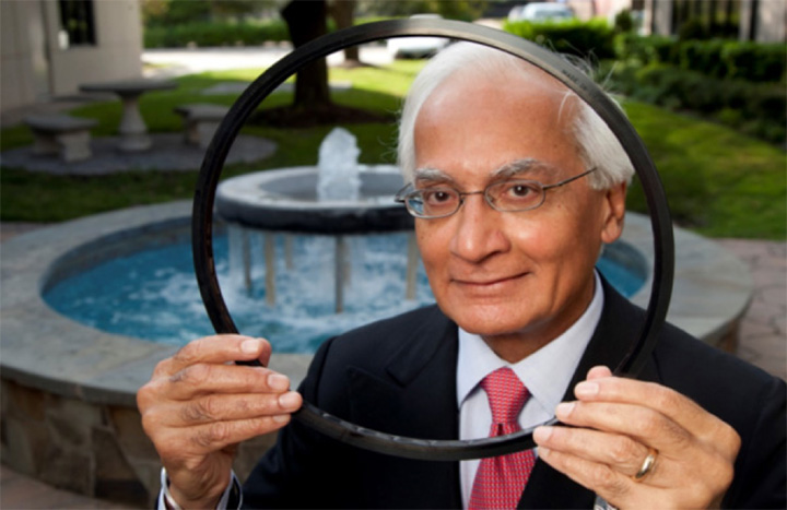 M. S. Kalsi, PhD, founder and President of Kalsi Engineering, Inc. poses with one of the company’s various types of hydrodynamically lubricated rotary shaft oil seals.